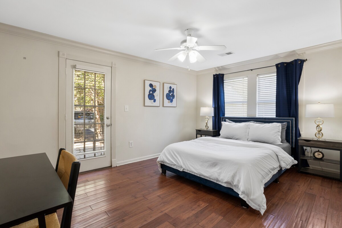 Master suite with walk-in closet, workspace, and patio access